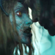 The Queen and Zeus, zombies from Army of the Dead, with their foreheads and noses touching.